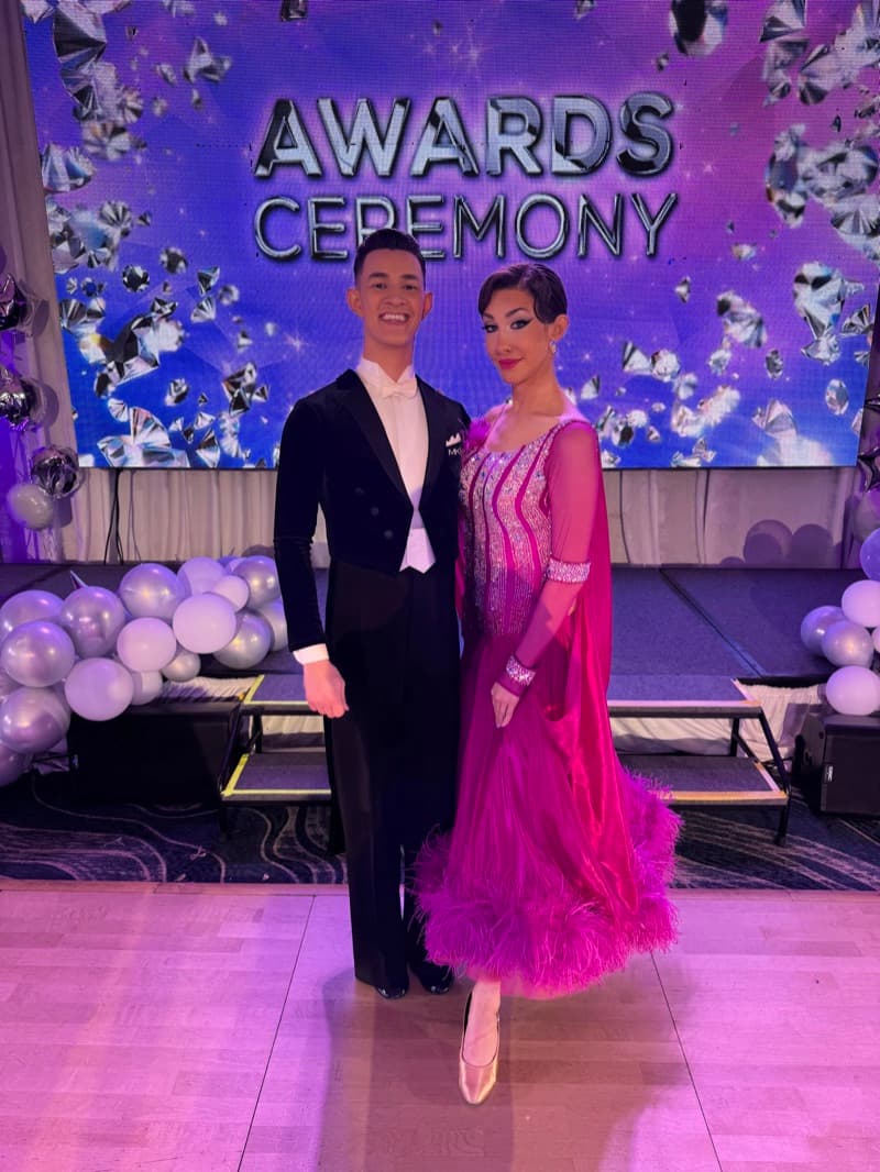 Alexander and Aubrey at a ballroom awards ceremony